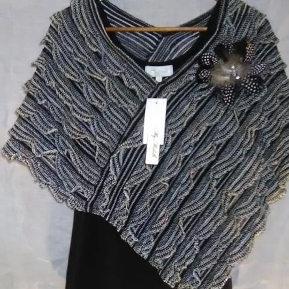 Black Tank top with a Ruffled Shaw attached.